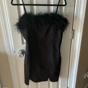 cocktail dress with feathered top perfect for New Year’s party